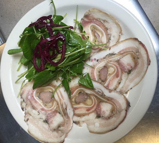 Dre's tête de porc served with a watercress and pickled shallot salad.