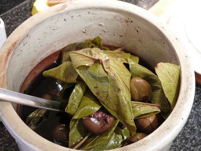 The red wine has been macerating with green walnuts and leaves, along with spices and bay leaves, for about 8 weeks