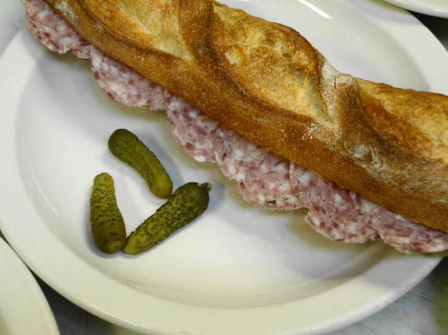 Sandwich with house-made smoked pork sausage.