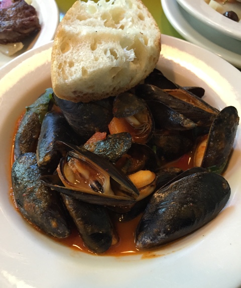Penn Cove mussels simmered with Basque-style sweet pepper compote and piment d'Espelette, with grilled baguette.