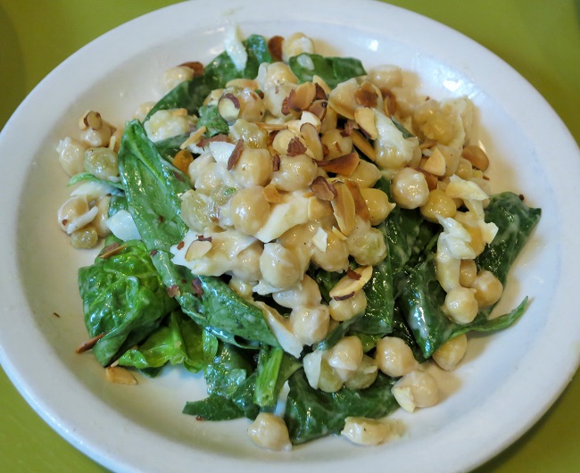 Salad of salt cod, marinated chickpeas, golden raisins, spinach and almonds, with a pastis vinagrette.