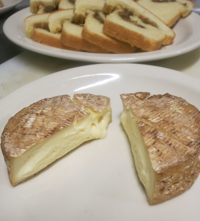 Camembert aged 20 days in Normandy cider, served wit caramelized onion-pork cracklin' brioche