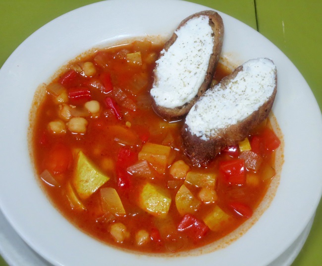 Garbanso bean soup simmered with Berbere spices, red peppers, summer squash and onions, served with goat cheese croutons